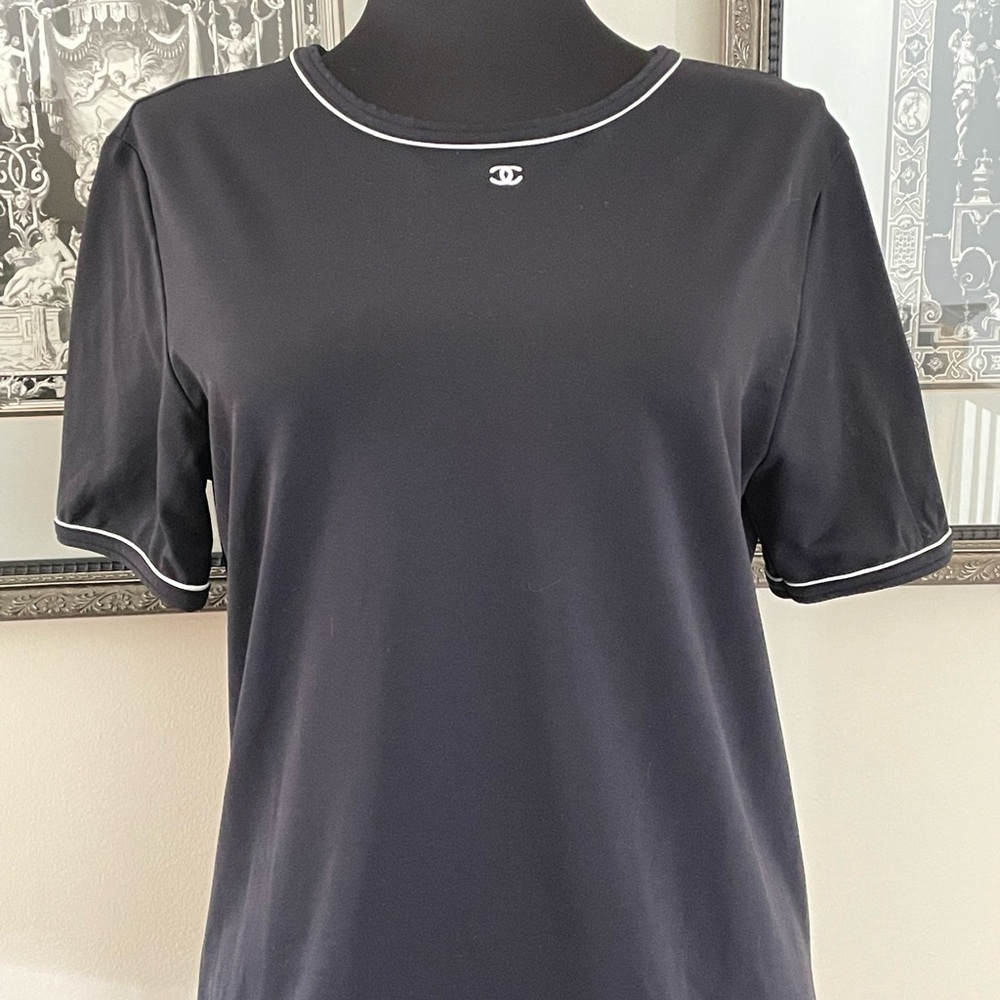 Chanel Uniform Black Tshirt with White CC’s and White Trim around Neck / Sleeves